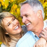 Older Couple Smiling - Dental Implants 